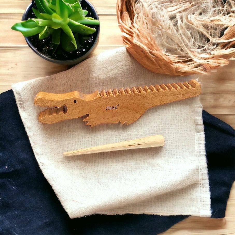 Wooden alligator music toy. Sound sensory exploration toy