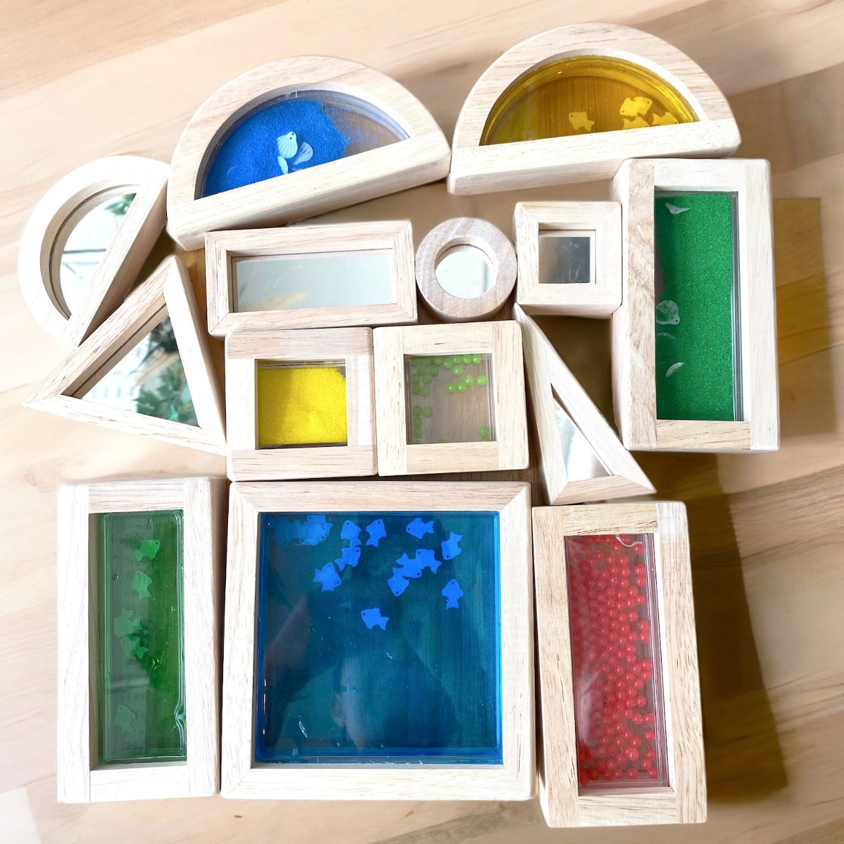 Wooden sensory blocks with liquid, sand with shells or beads