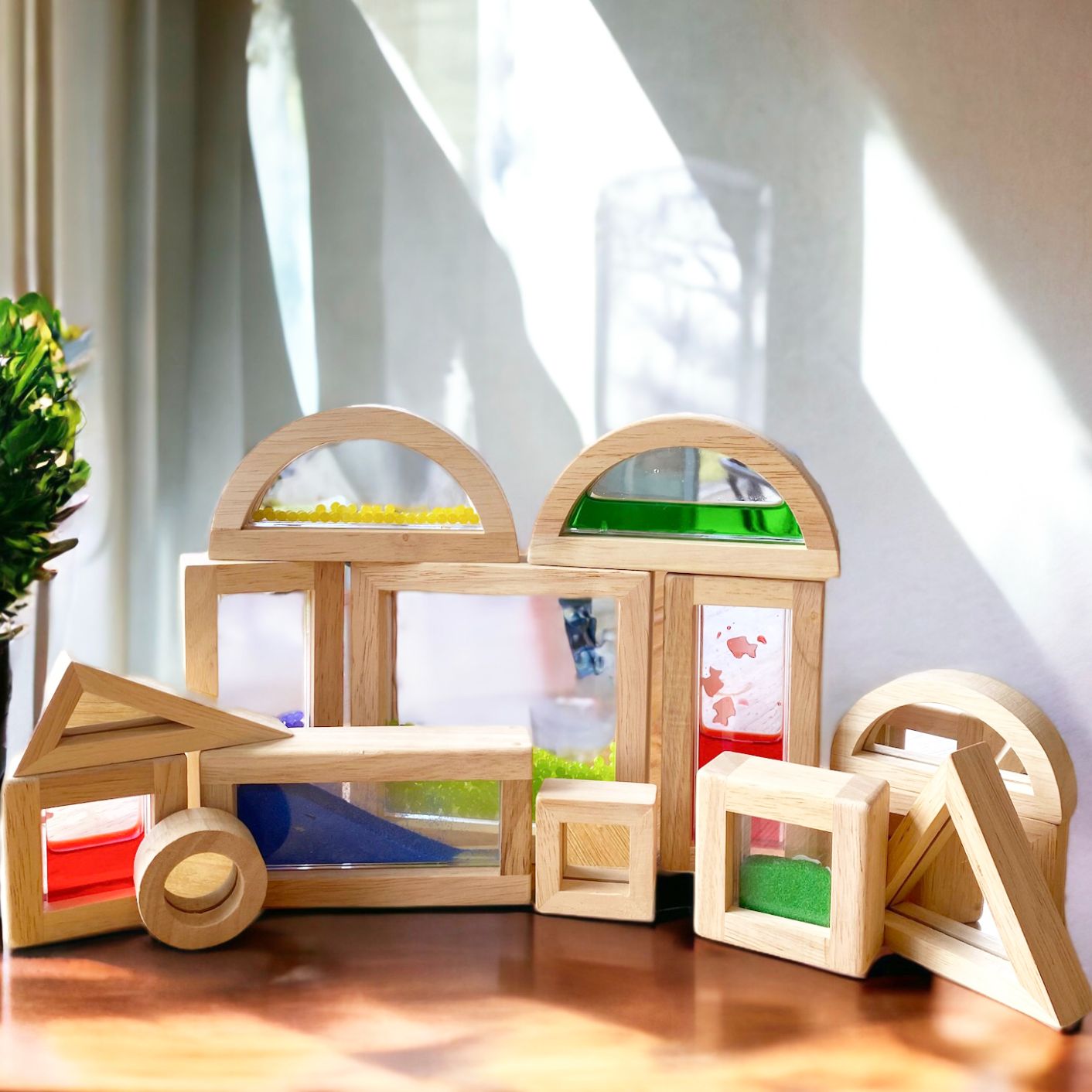 Wooden sensory blocks with liquid, sand with shells or beads