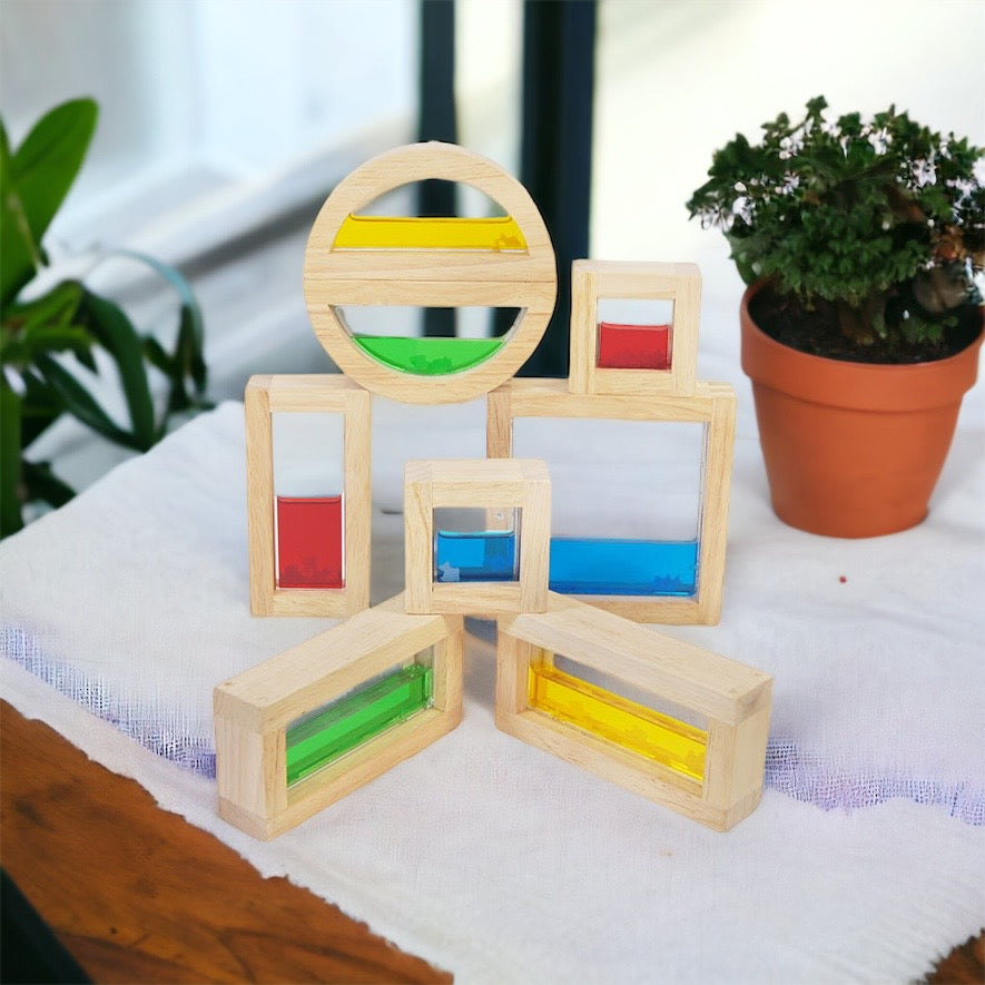 Wooden sensory blocks, liquid with fish, sand with shells or beads with sound