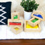 Wooden sensory blocks, liquid with fish, sand with shells or beads with sound