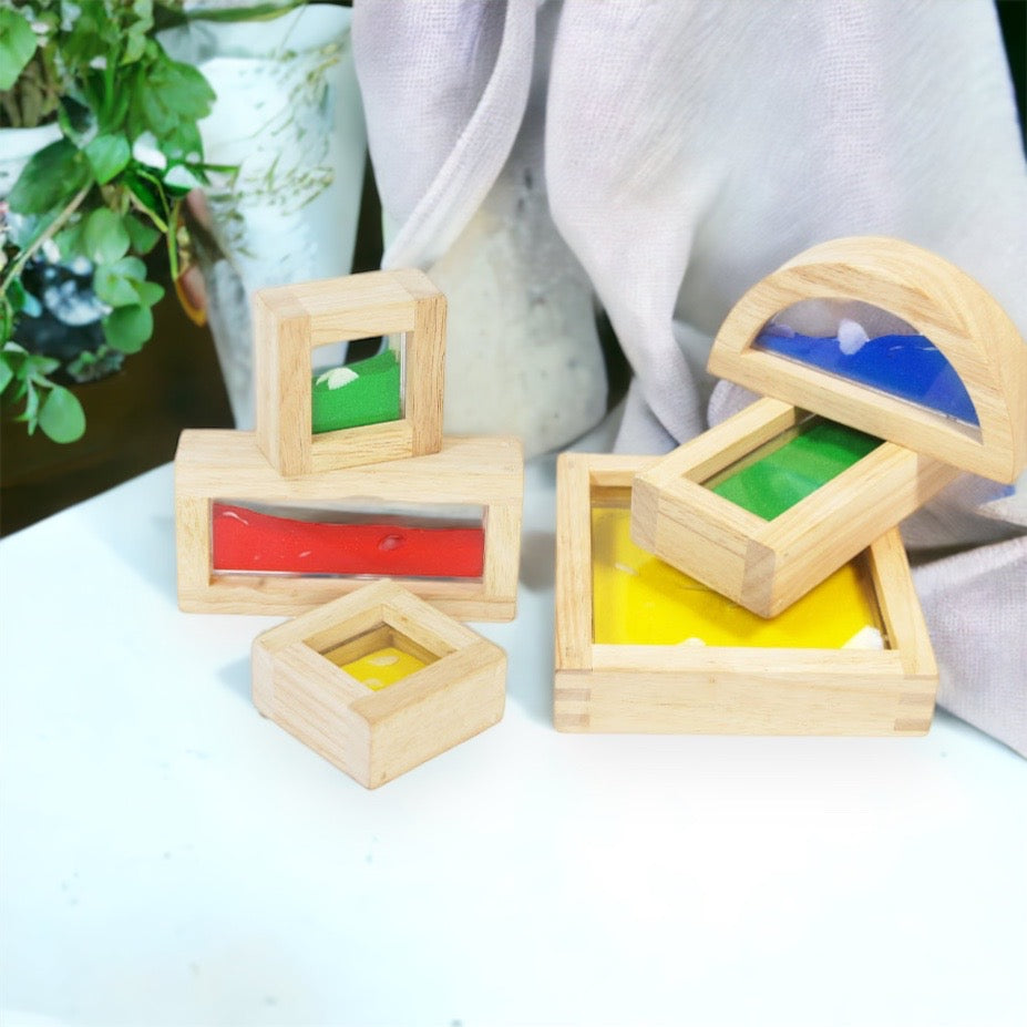 Wooden sensory blocks, liquid with fish, sand with shells or beads with sound