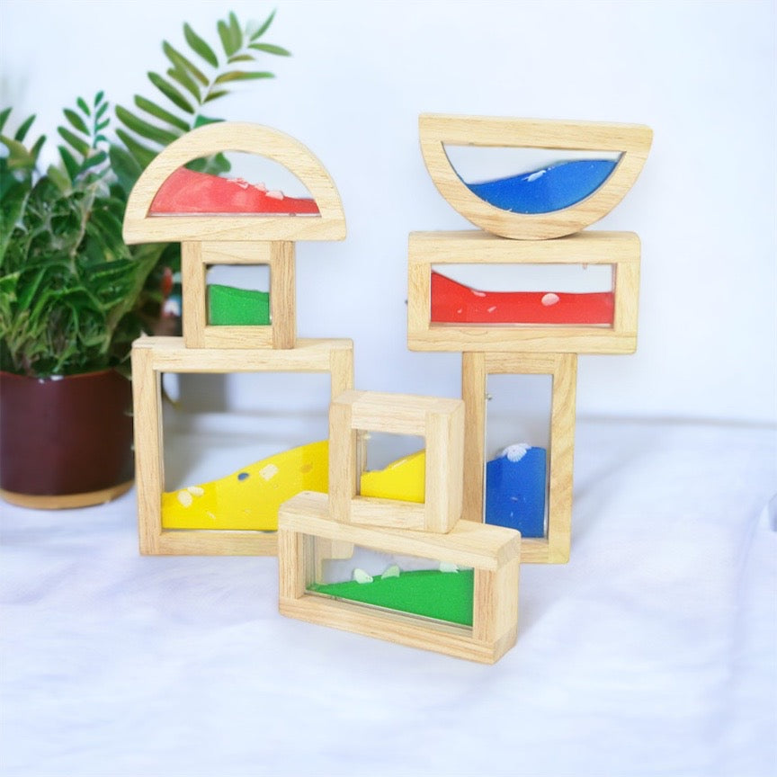 Wooden sensory blocks, liquid with fish, sand with shells or beads with sound