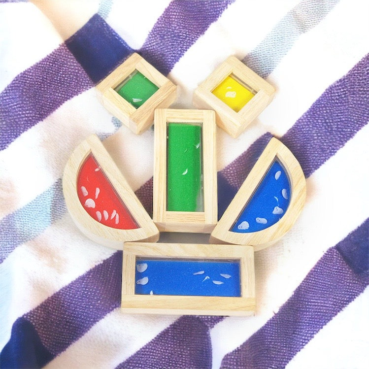 Wooden sensory blocks, liquid with fish, sand with shells or beads with sound