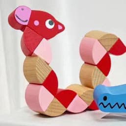 Twisting Wooden Children Toy. Red Giraffe